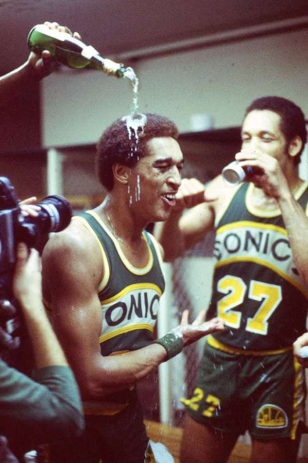 GRATEST MOMENT: Seattle Supersonics celebrate victory over Washington Bullets: D. Johnson has champagne poured on his head.  6/1/79, Landover, MD. Credit: Walter Iooss Jr. SetNumber: X23441 TK2 R2 F1